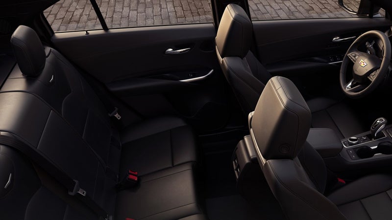 Interior view of a car featuring leather seats and a steering wheel